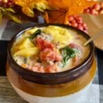 A bowl of sausage tortellini soup.