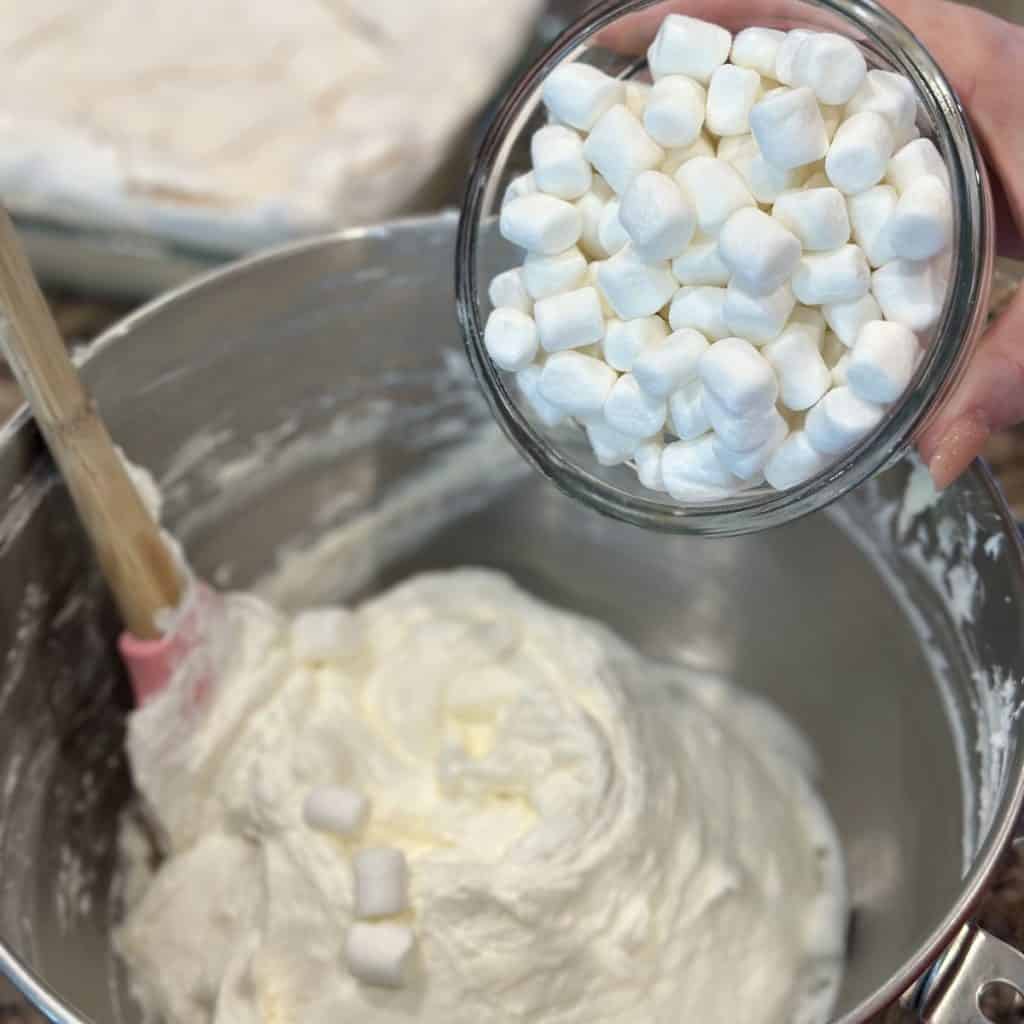 Fold marshmallows in a whipped topping filling.