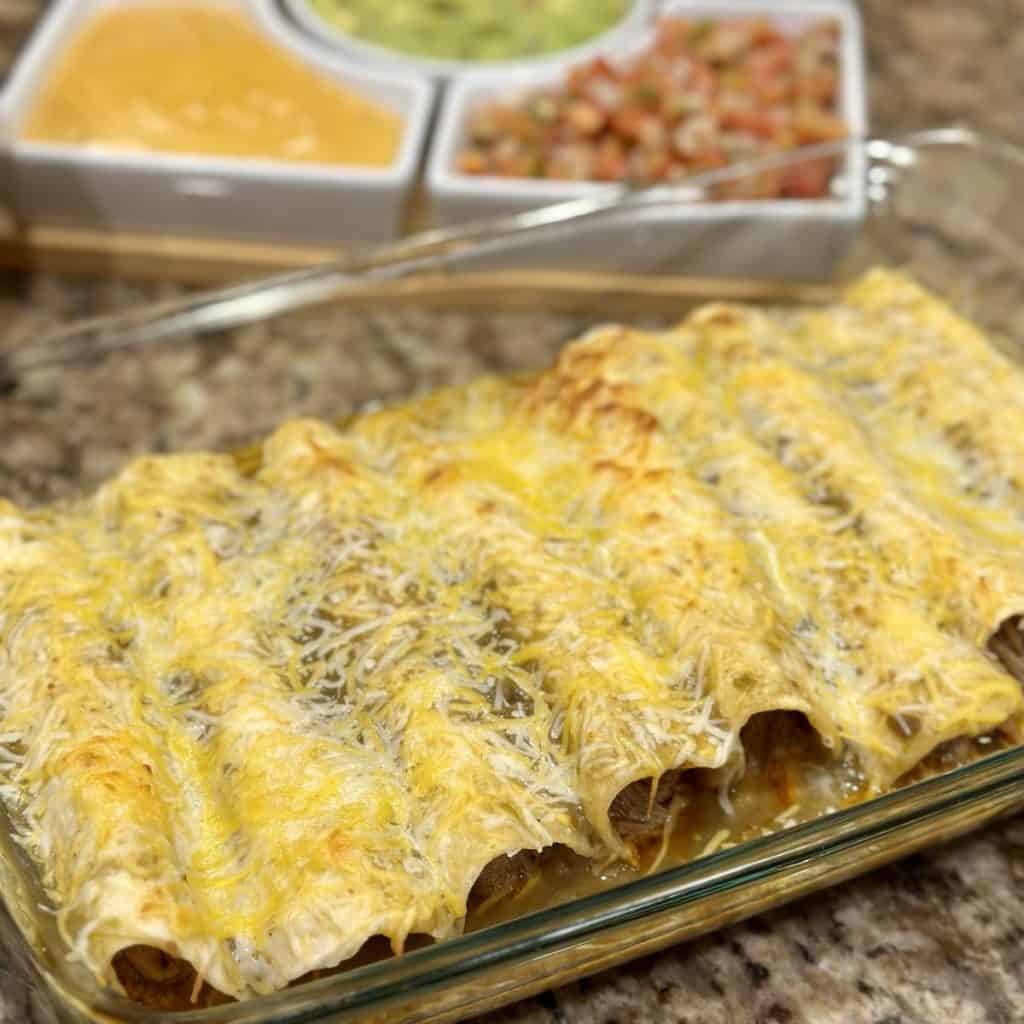 A dish of pork enchiladas.