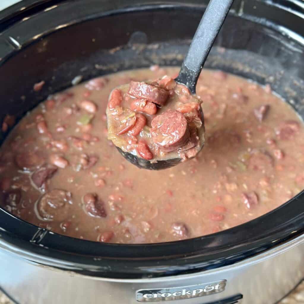 A ladle of red beans and rice.