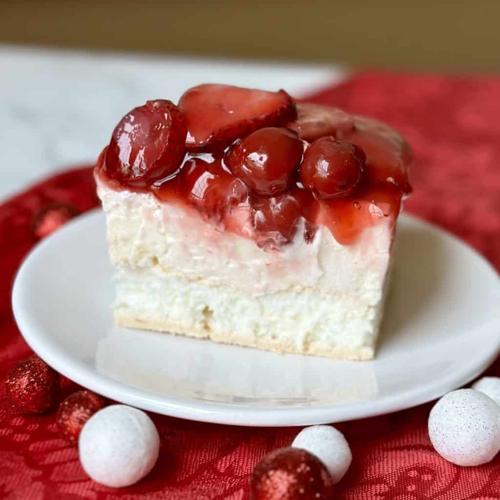 A slice of cherry berry on a cloud dessert.