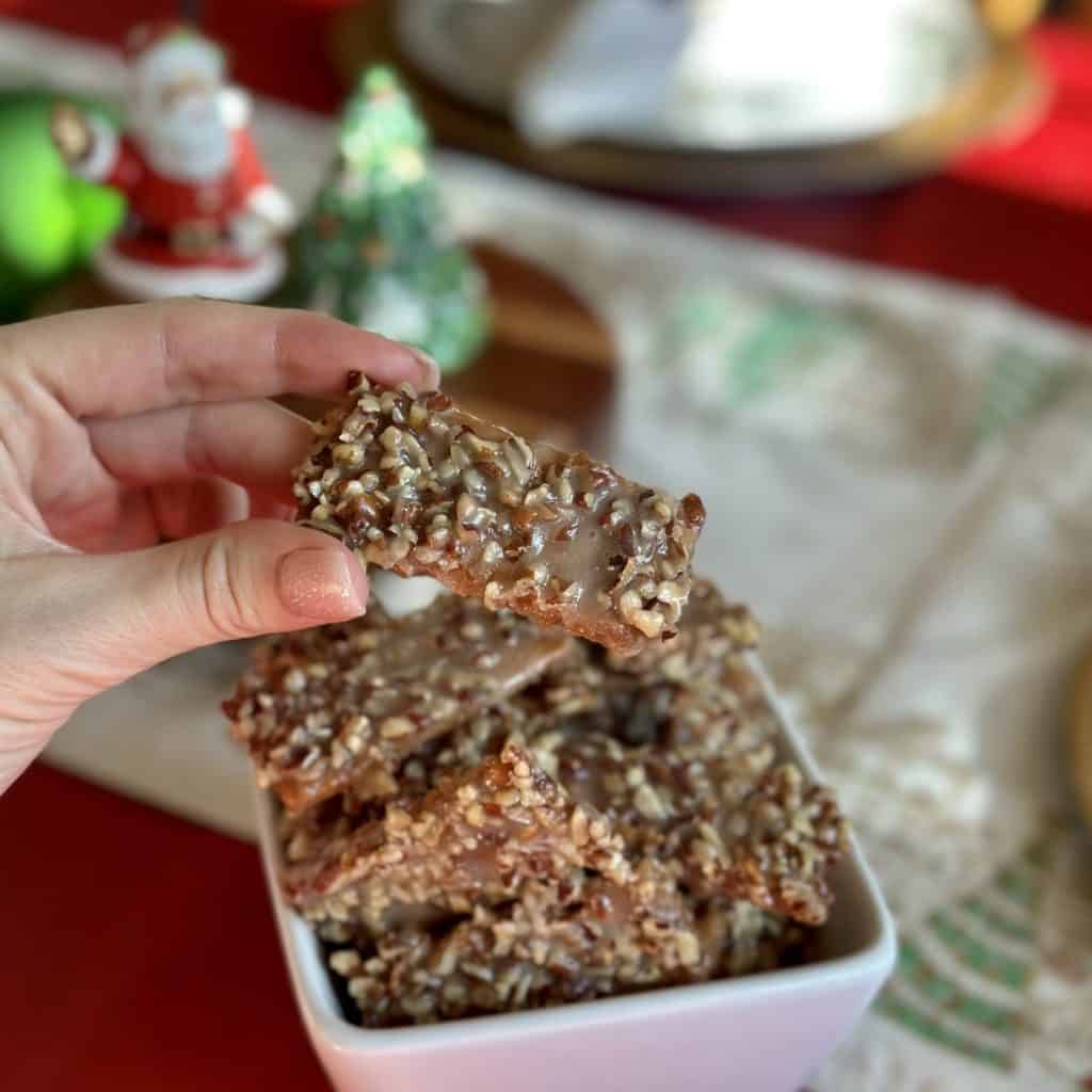 Holding a graham cracker toffee bar.