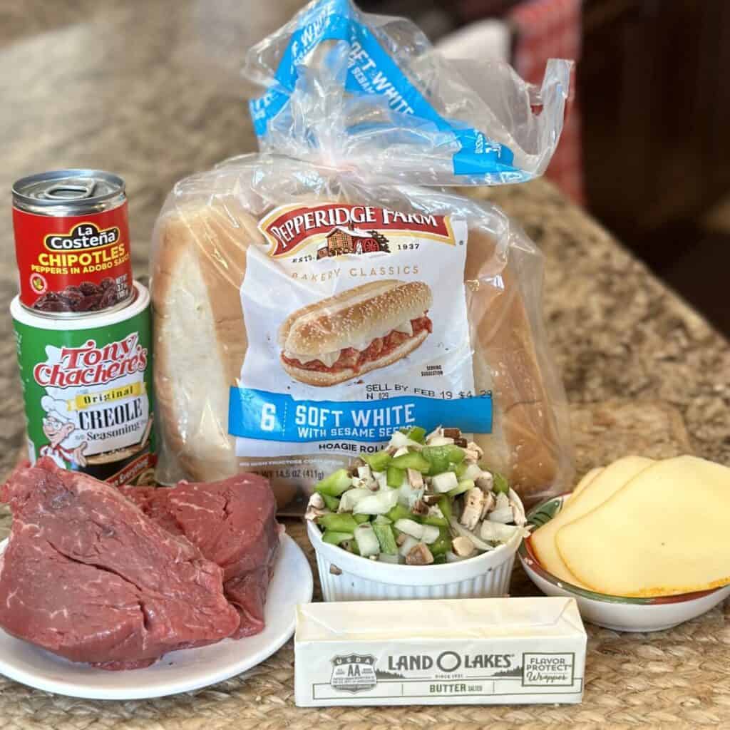 The ingredients needed to make steak sandwiches.