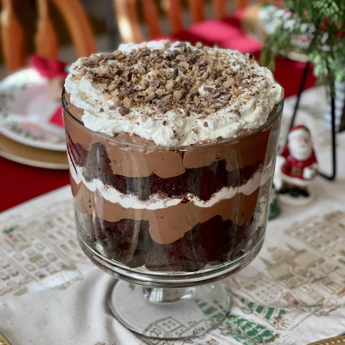 This is an image of a chocolate trifle in a glass trifle dish.