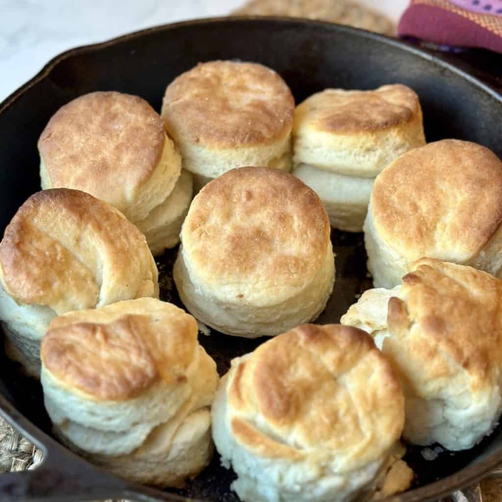 A cast iron skillet of biscuits.