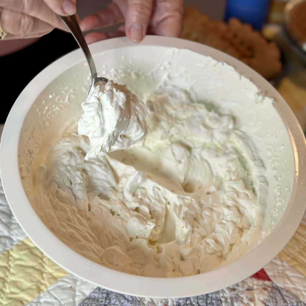 Making whipped cream with a mixer.