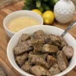 Pork tenderloin bites in a bowl.