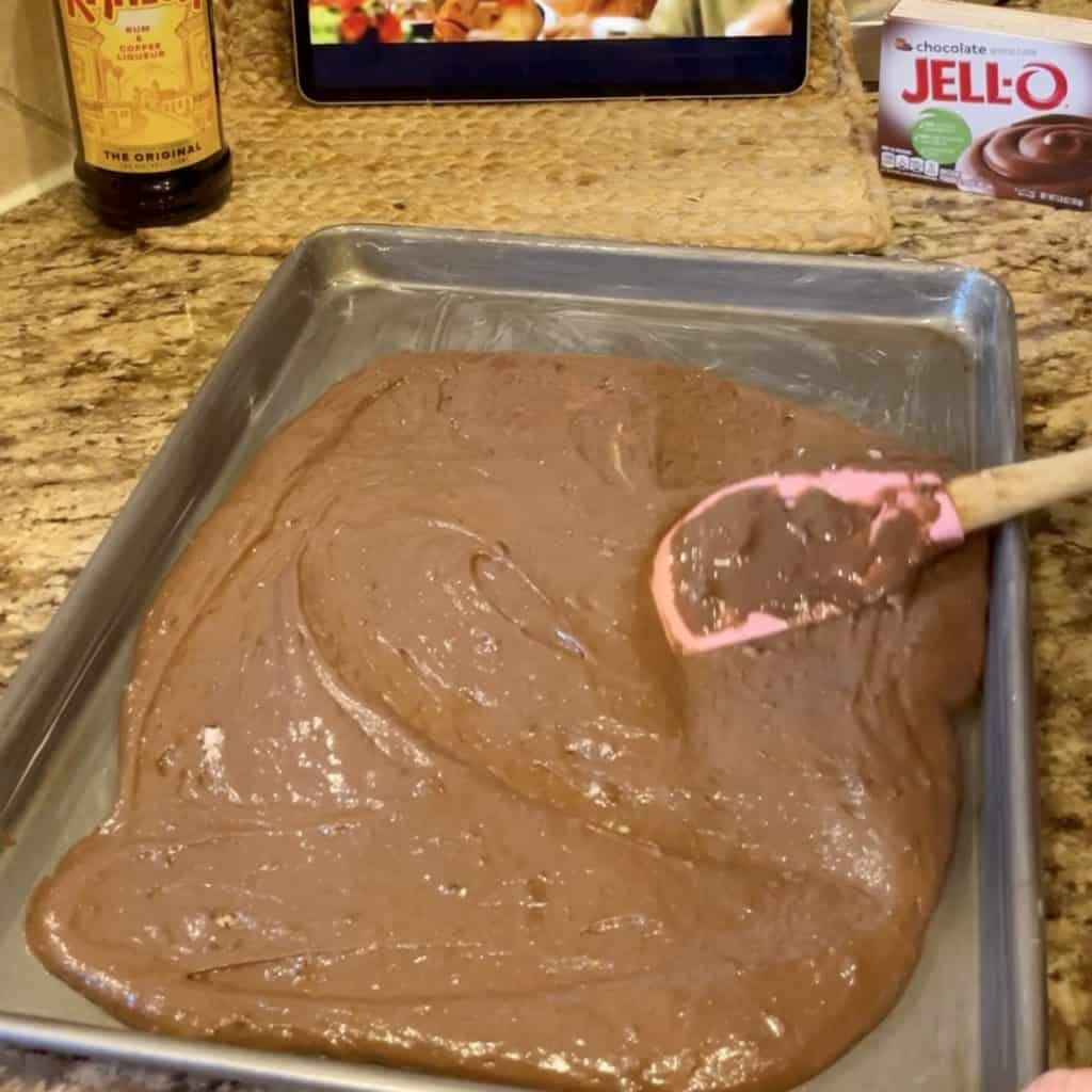 Spreading batter on a sheet pan.