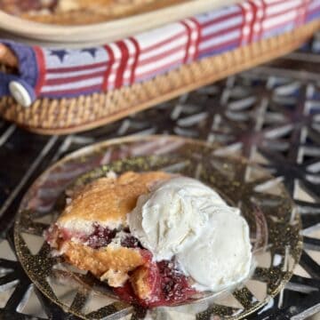 A serving of fruit cobbler on a plate.