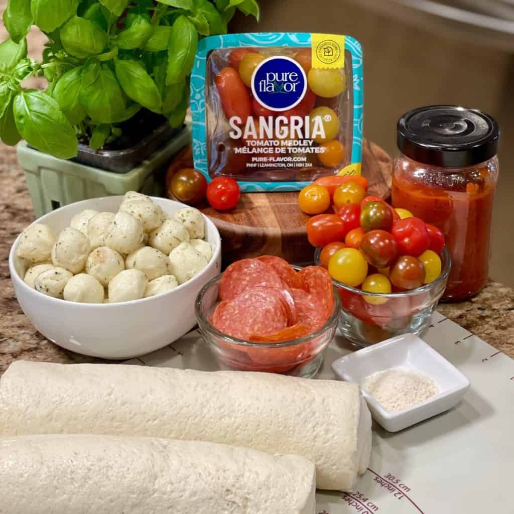 Ingredients to make pizza pull apart rolls.