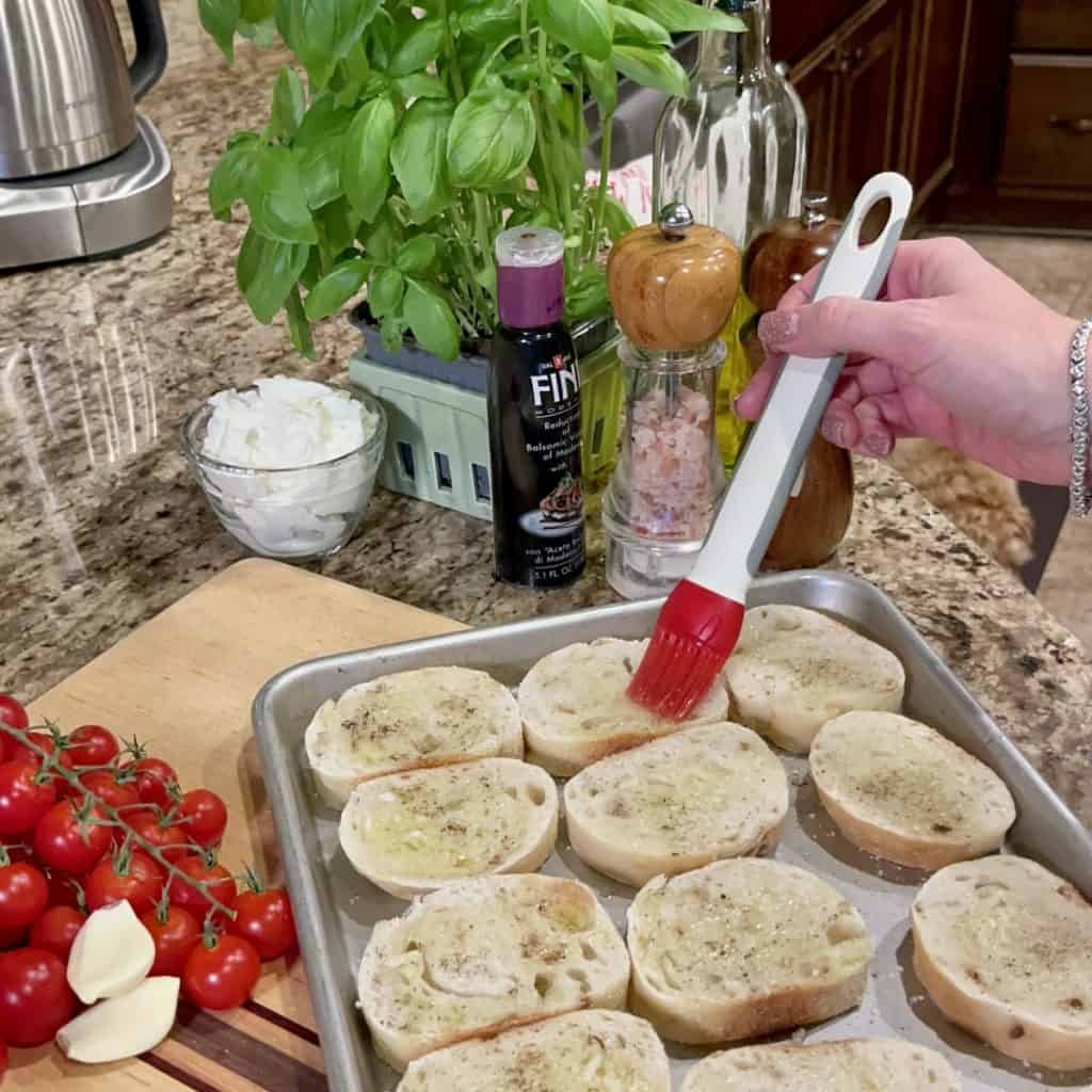 Brush olive oil on toasts.