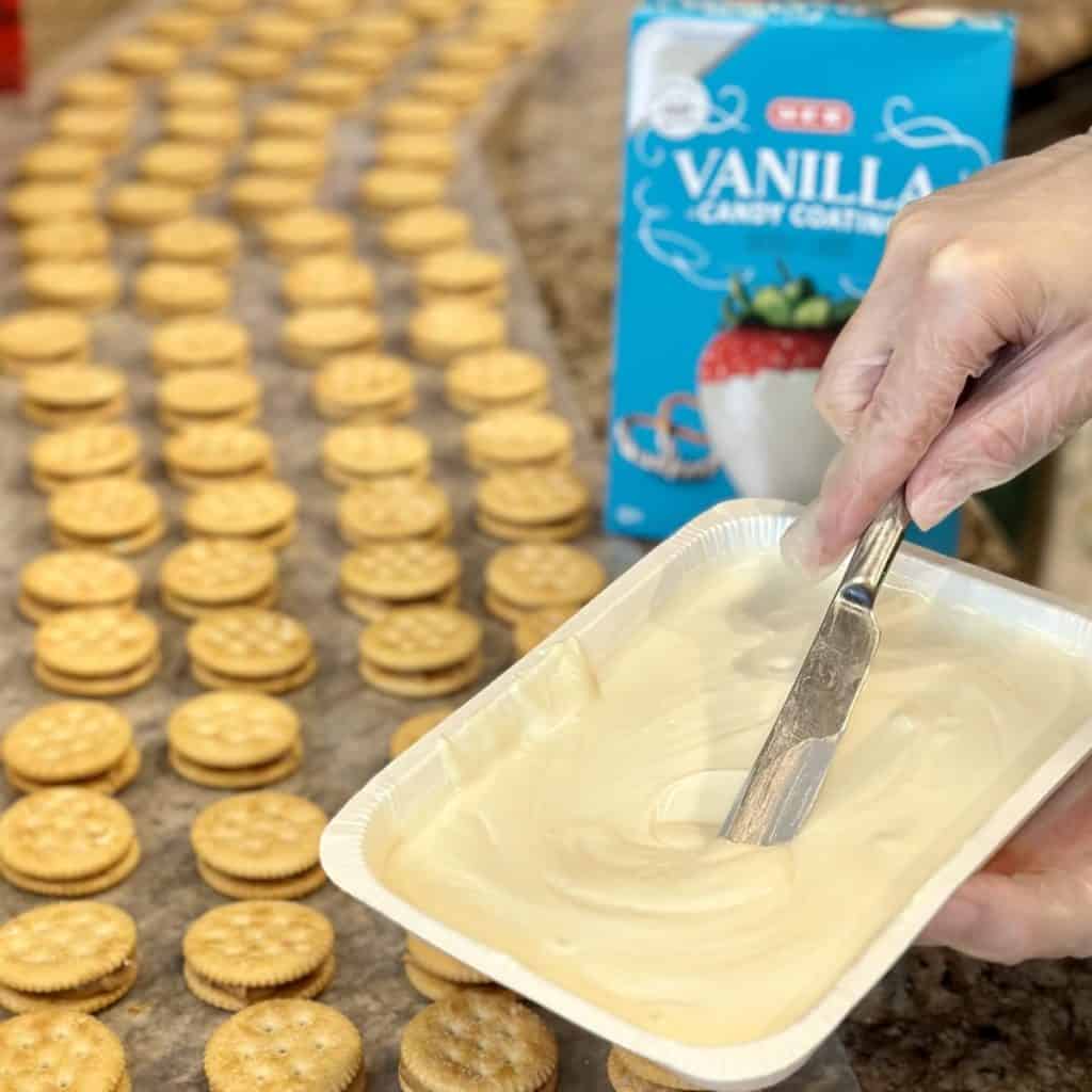 Whisking melted vanilla candy coating.