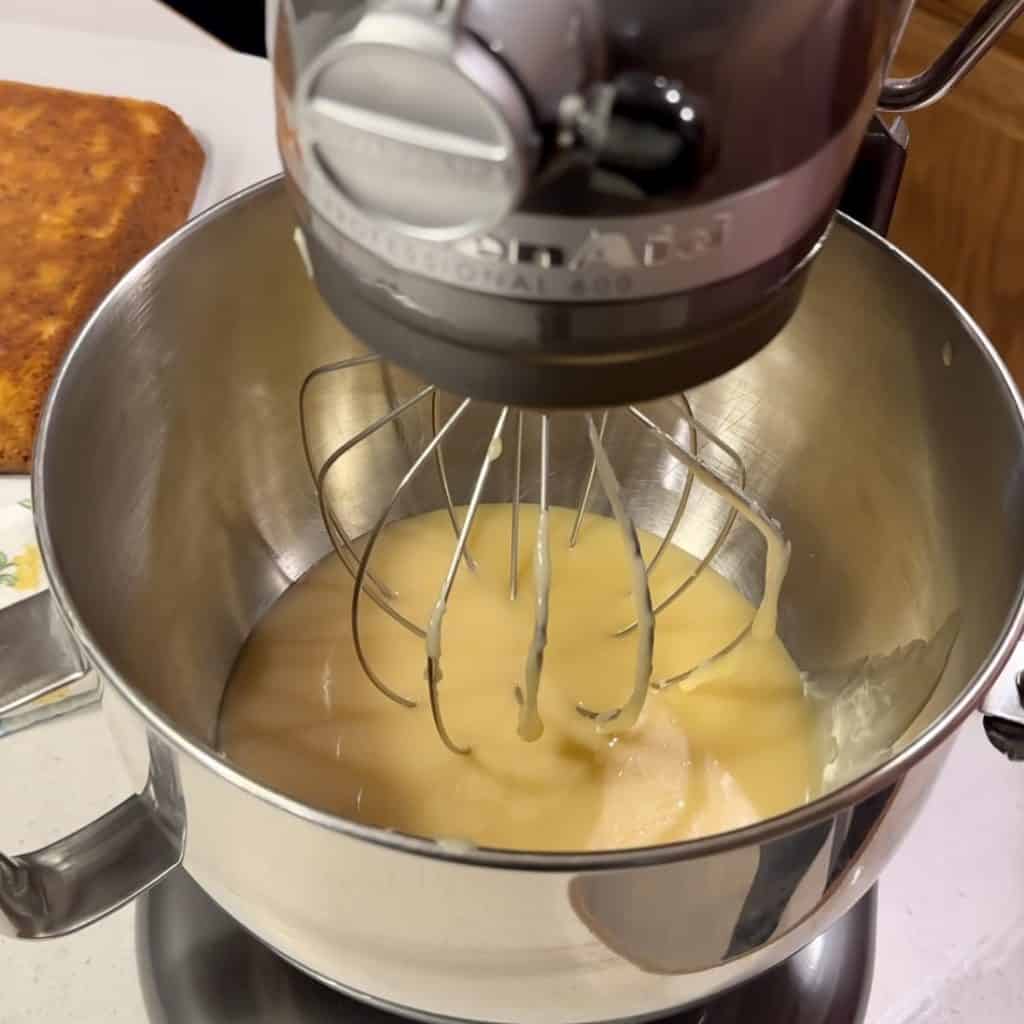 Whipping icing in a mixer.