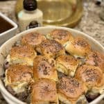 A baking dish full of roast beef sliders.