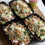 Four prepared chopped salad.