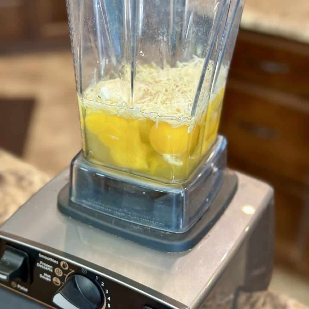 The ingredients for scrambled eggs in a blender.