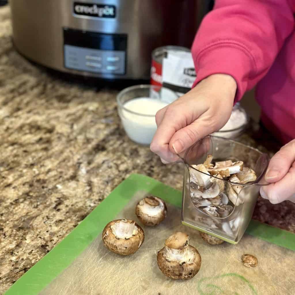 Slicing mushrooms.