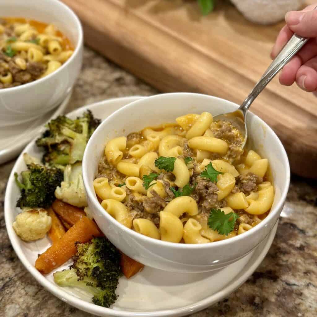 A serving of beef Mac and cheese with a cajun seasoning.