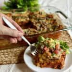 A slice of taco lasagna on a plate.