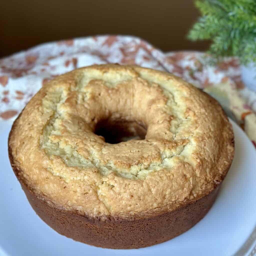 A pound cake on a plate freshly baked.