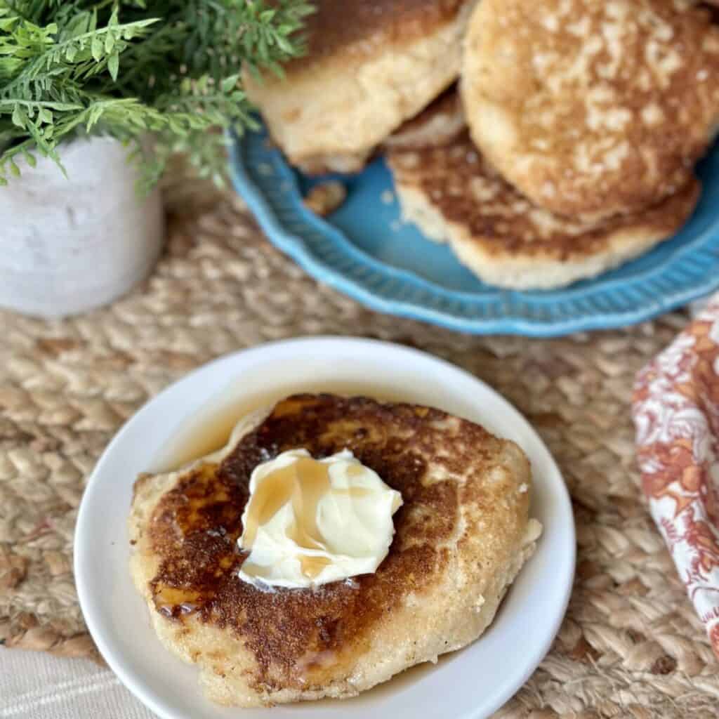 A hoecake with butter and syrup on top.