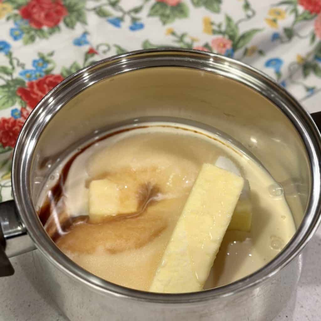 Butter and sugar being melted in a skillet.