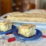 Slices of white chocolate cake on a saucer.