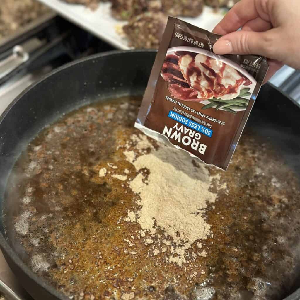 Adding brown gravy to a skillet.