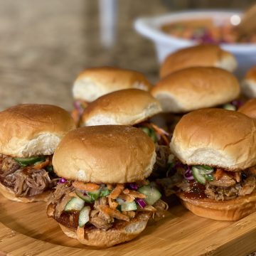 This is a picture of a pulled pork slider sandwich with slaw.