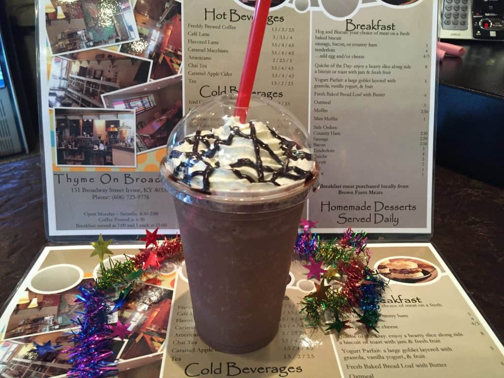 frozen hot chocolate displayed in front of a restaurant menu