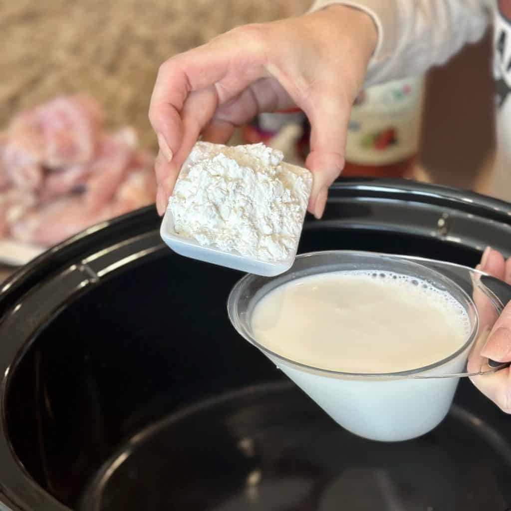 Combining cornstarch and milk for a crockpot dish.