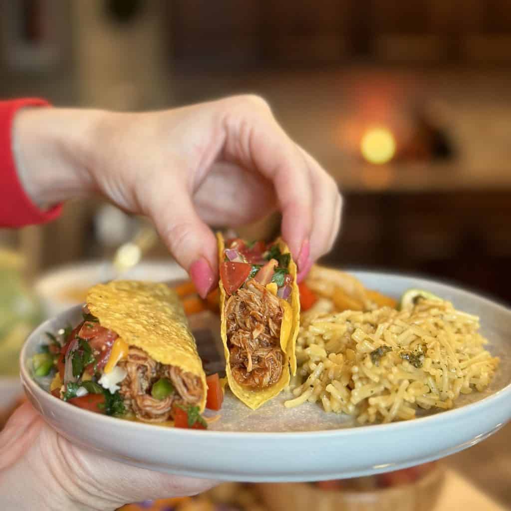 A taco with sweet pork inside.