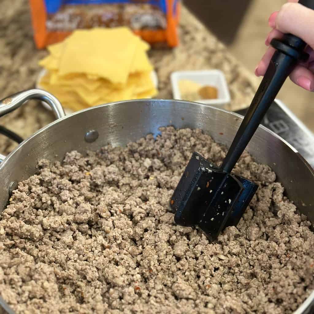 browning ground beef in a pot