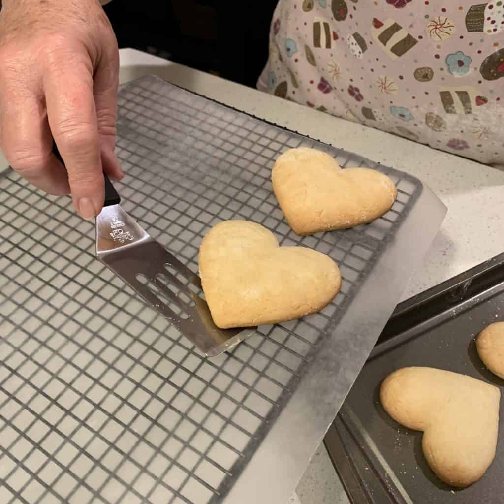 transferring the cookies to a cooling rack