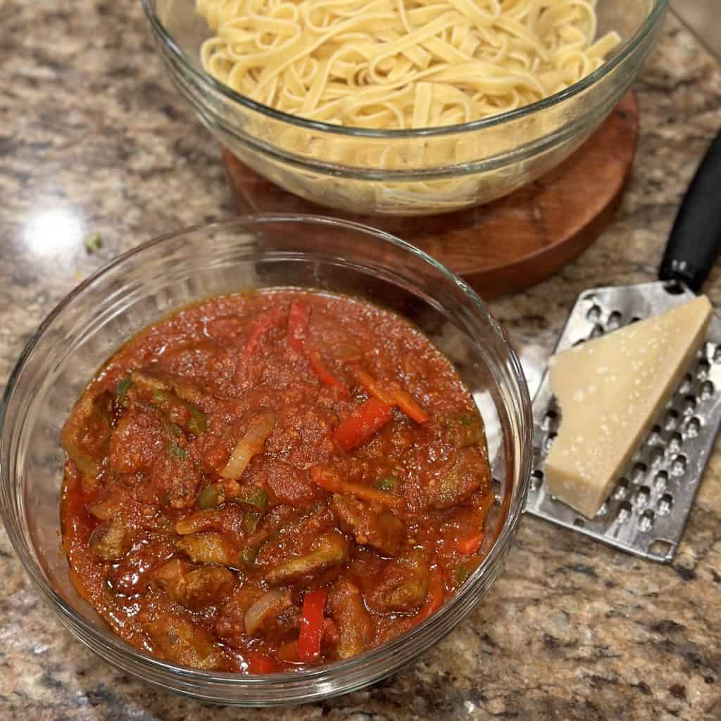 prepared sauce and prepared noodles, each in a bowl