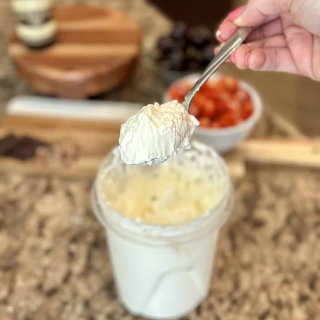 whipped cream with stiff peaks on a spoon