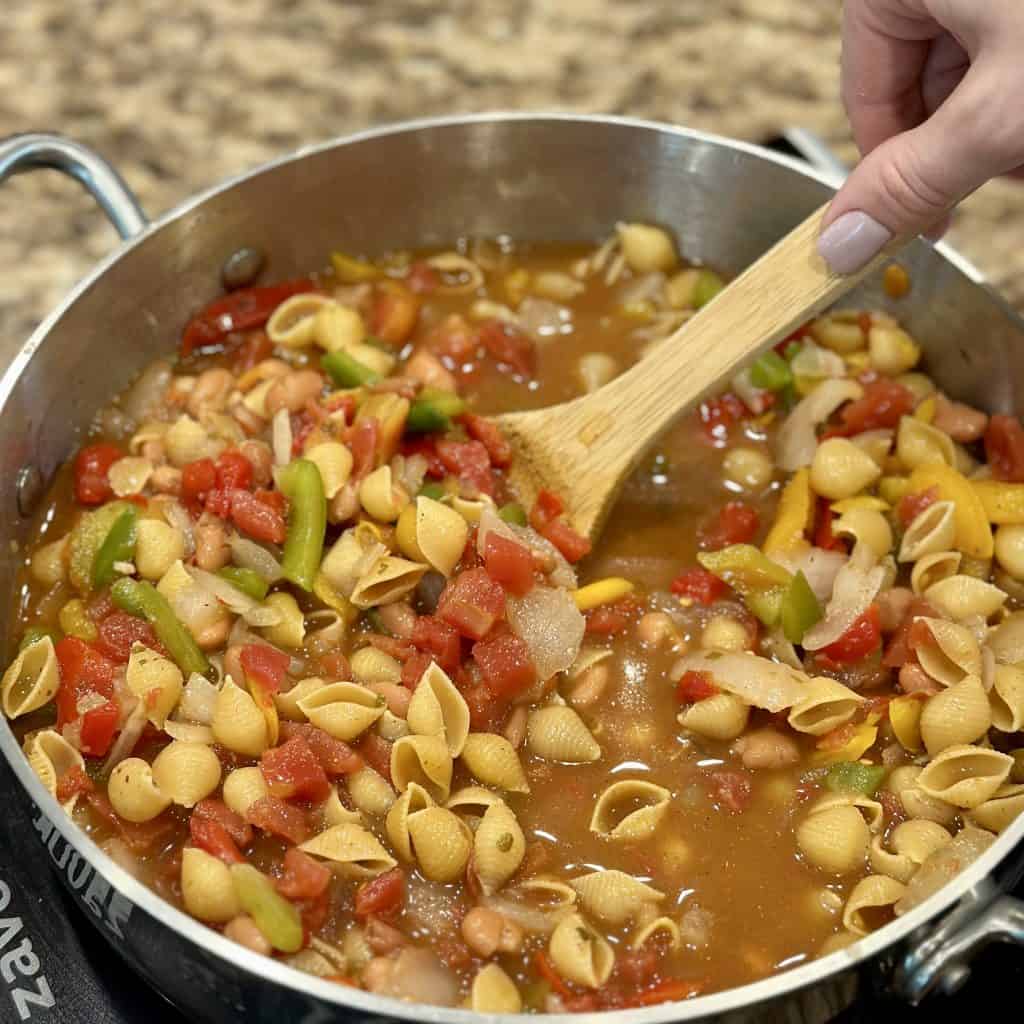 Combining ingredients and cooking pasta in a pot