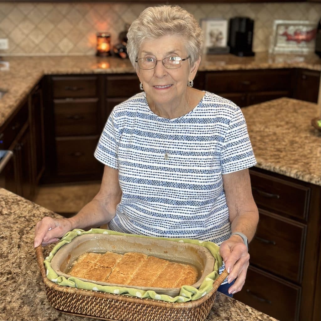 Mamaw holding a basket full of fresh baked rolls