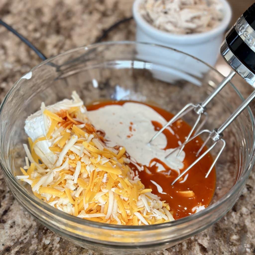 combining ingredients in a glass bowl