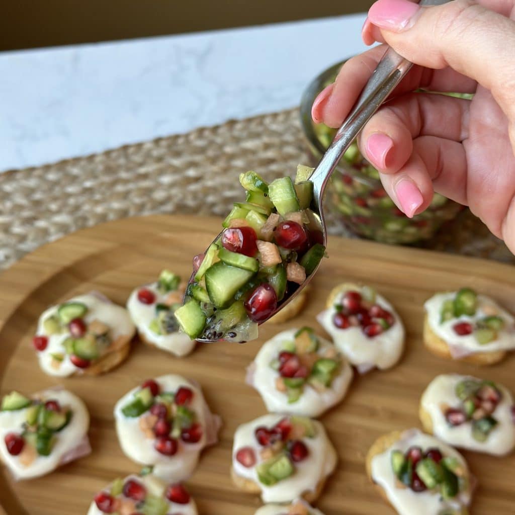 A close up shot of cucumber caviar in a serving spoon