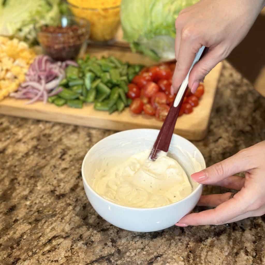 Combining wet ingredients for salad layer