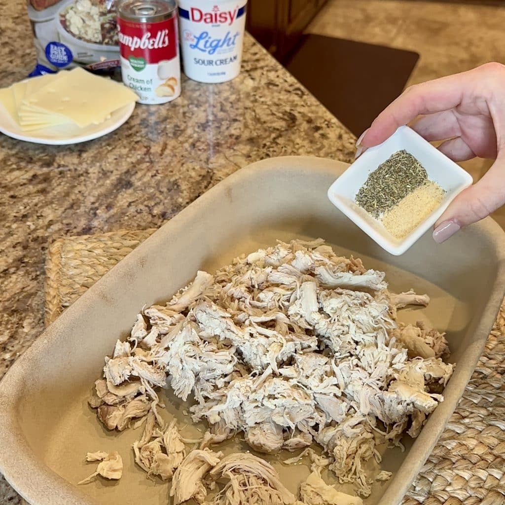 Adding seasoning to shredded chicken