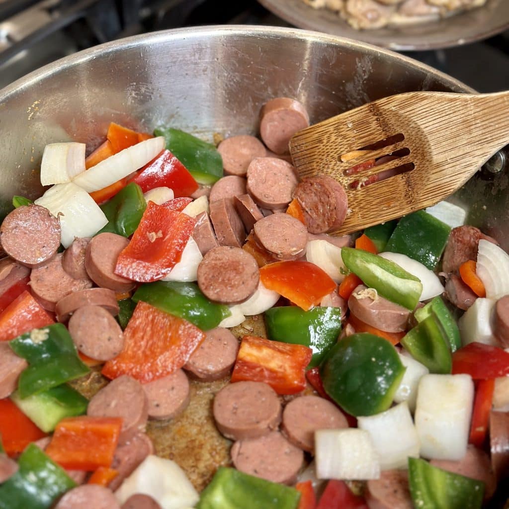 Adding the sausage and vegetables