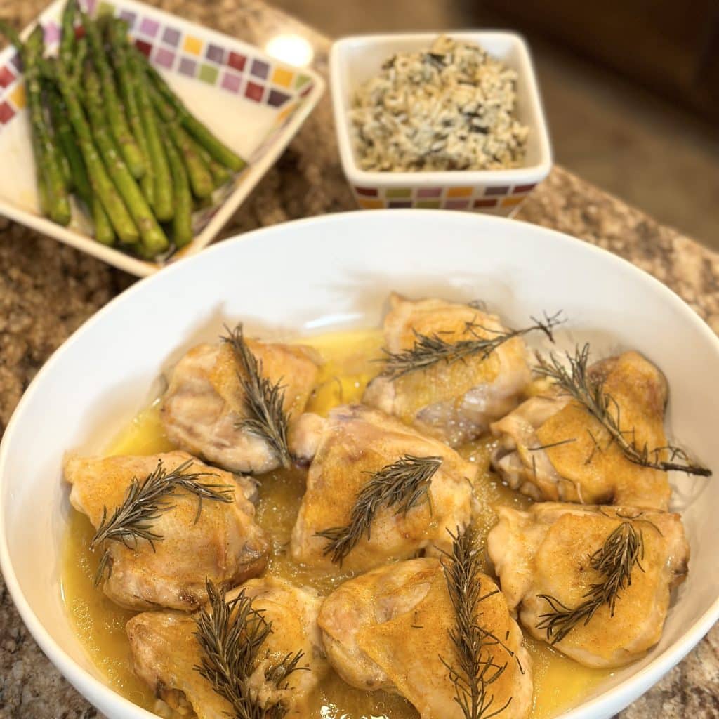 Oven roasted chicken with fresh rosemary on a plate