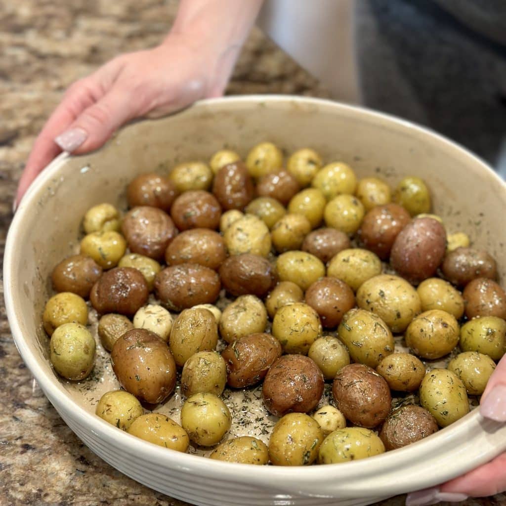 Finished roasted ranch baby potatoes in a serving bowl