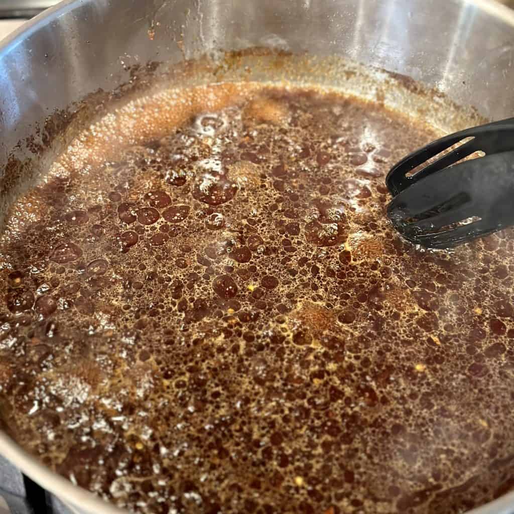simmering pan of sauce