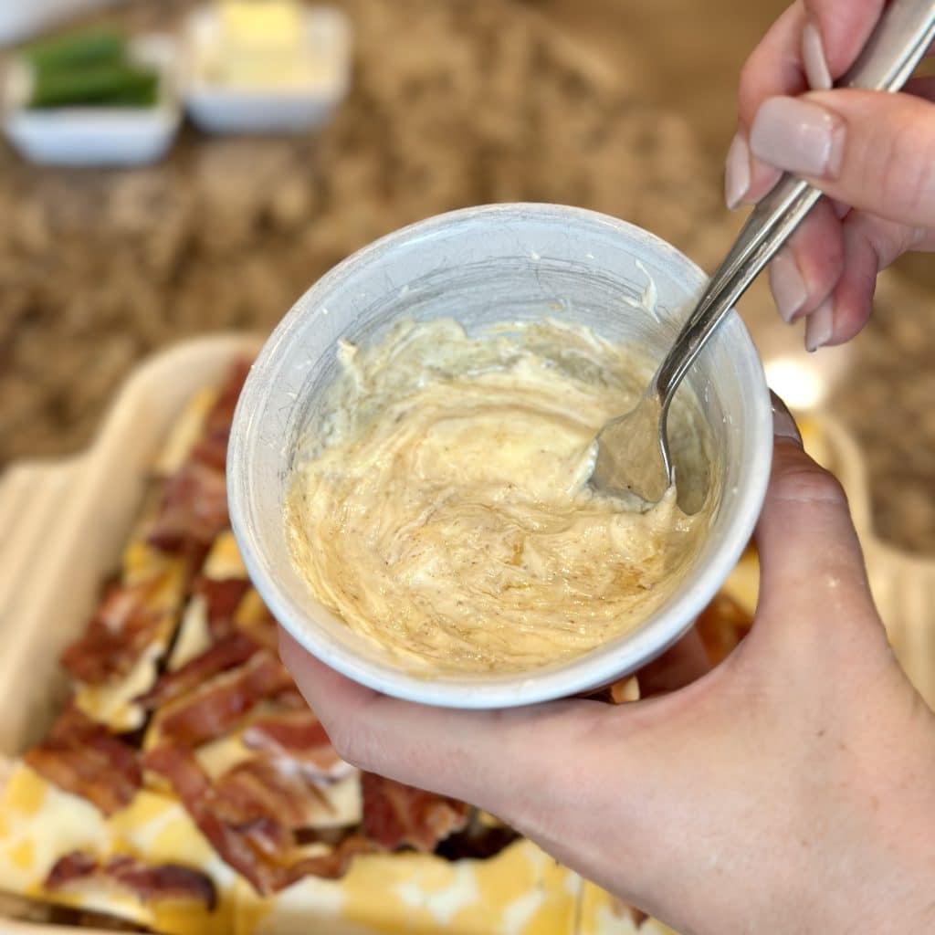 stirring a sauce in a bowl