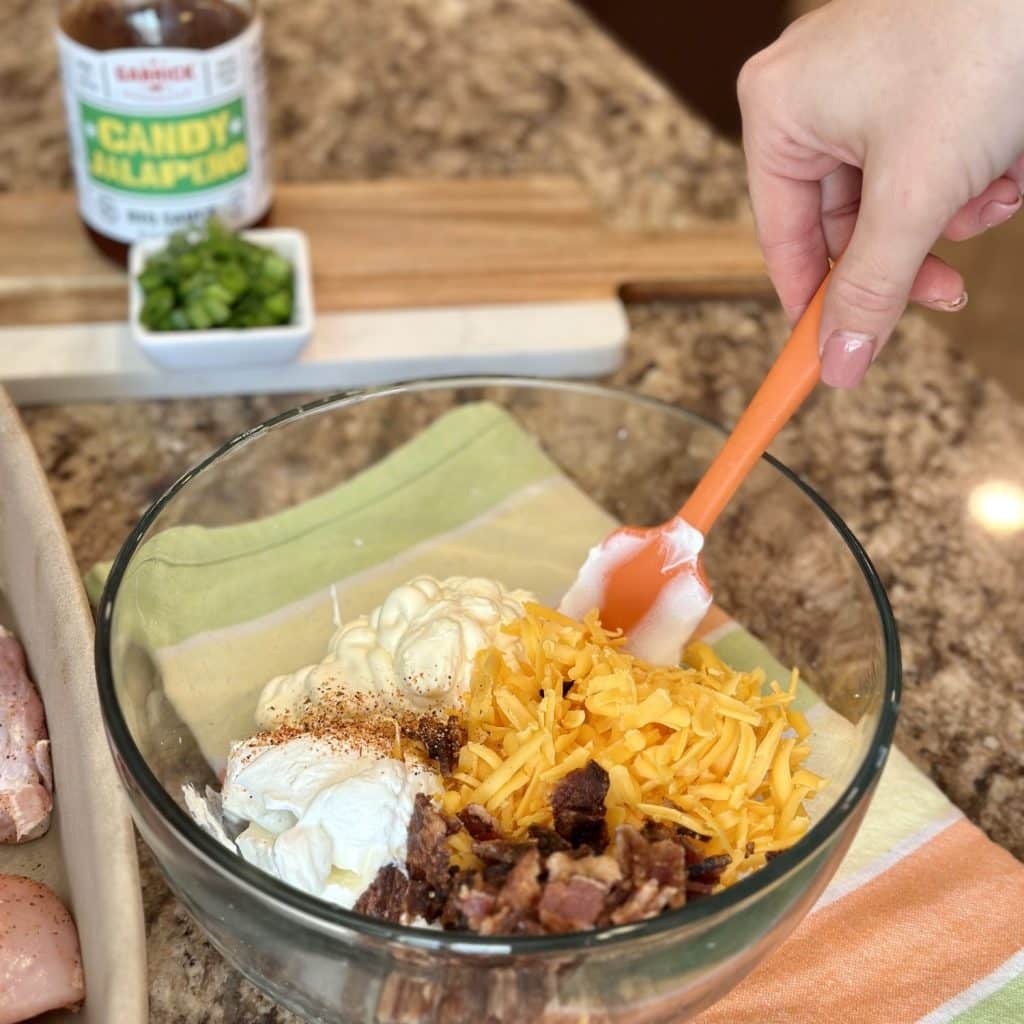 A bowl of prepared sauce to spread on chicken 