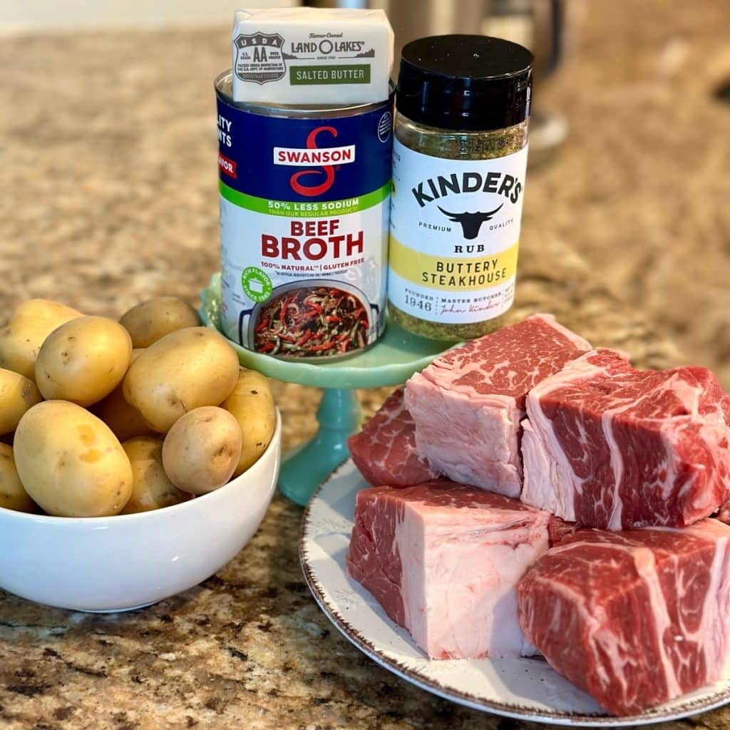 Beef, potatoes, beef broth, seasoning and butter to be put in a crockpot