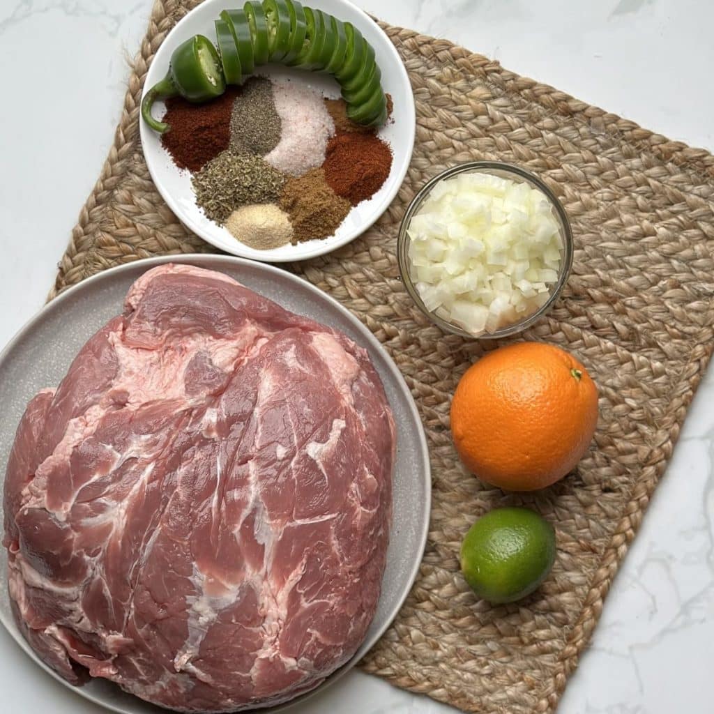 Ingredients needed for pork carnitas are pictured